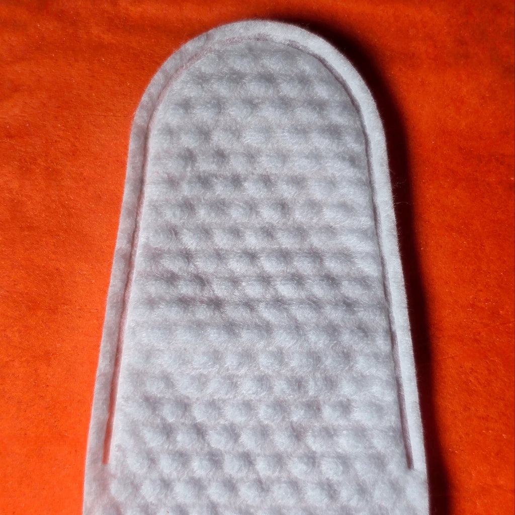 finger wipe close up on orange background