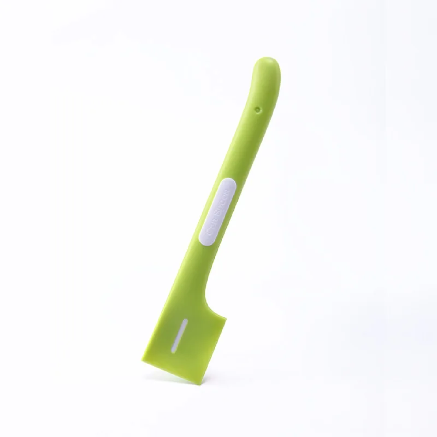 Green spoon on a white background