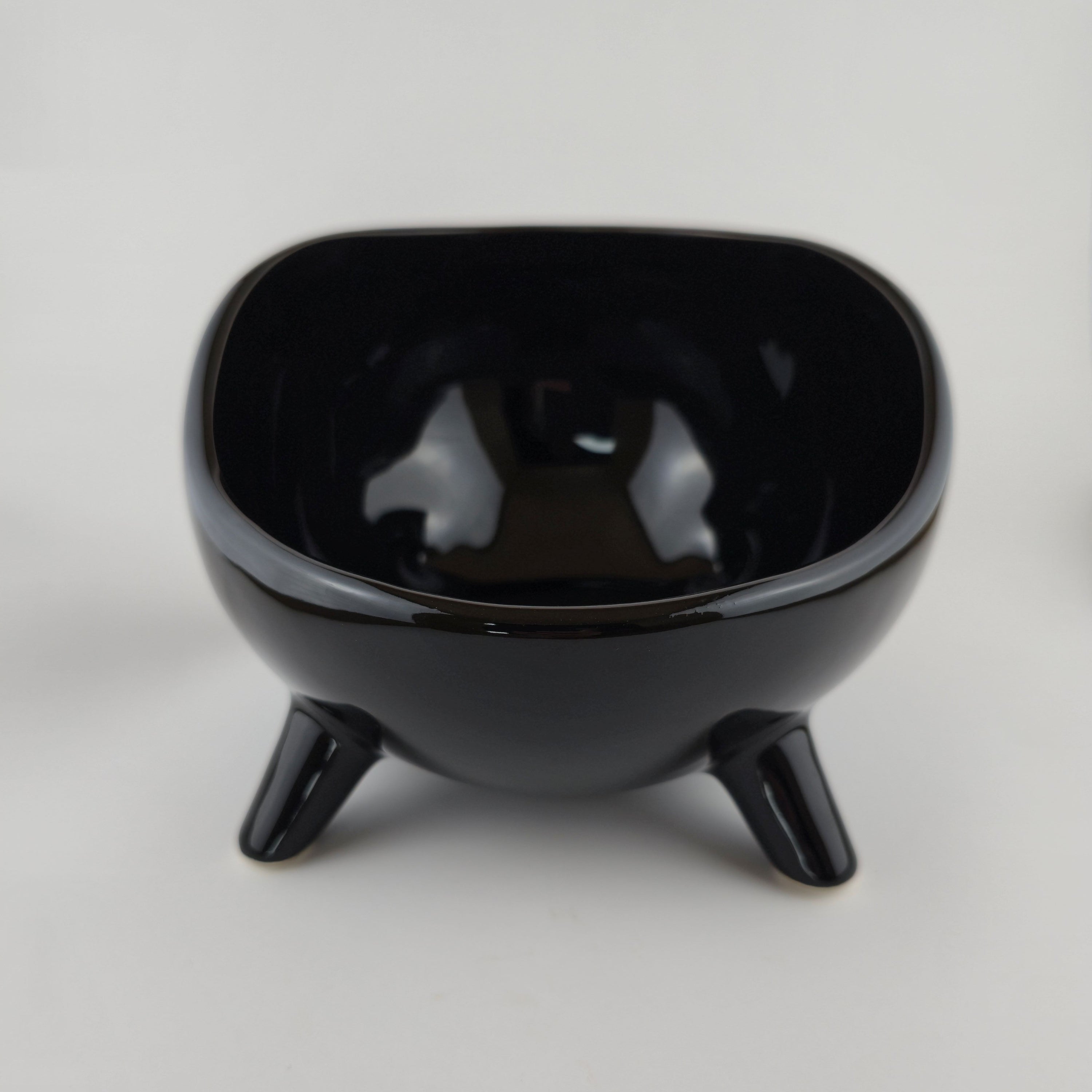 Black ceramic bowl on a white background