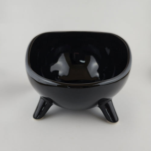 Black ceramic bowl on a white background