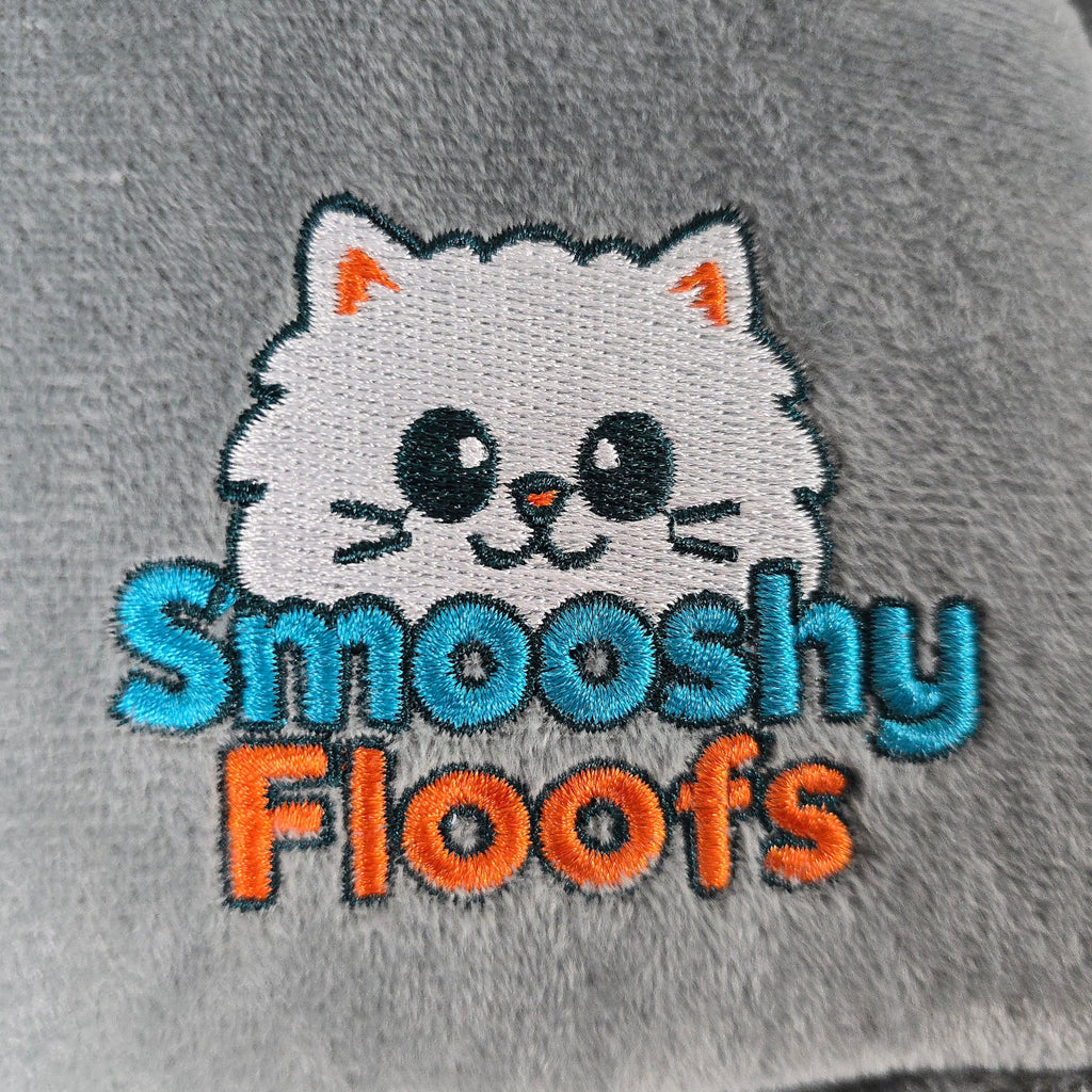 cat logo and 'Smooshy Floofs' text on a gray background of catbed