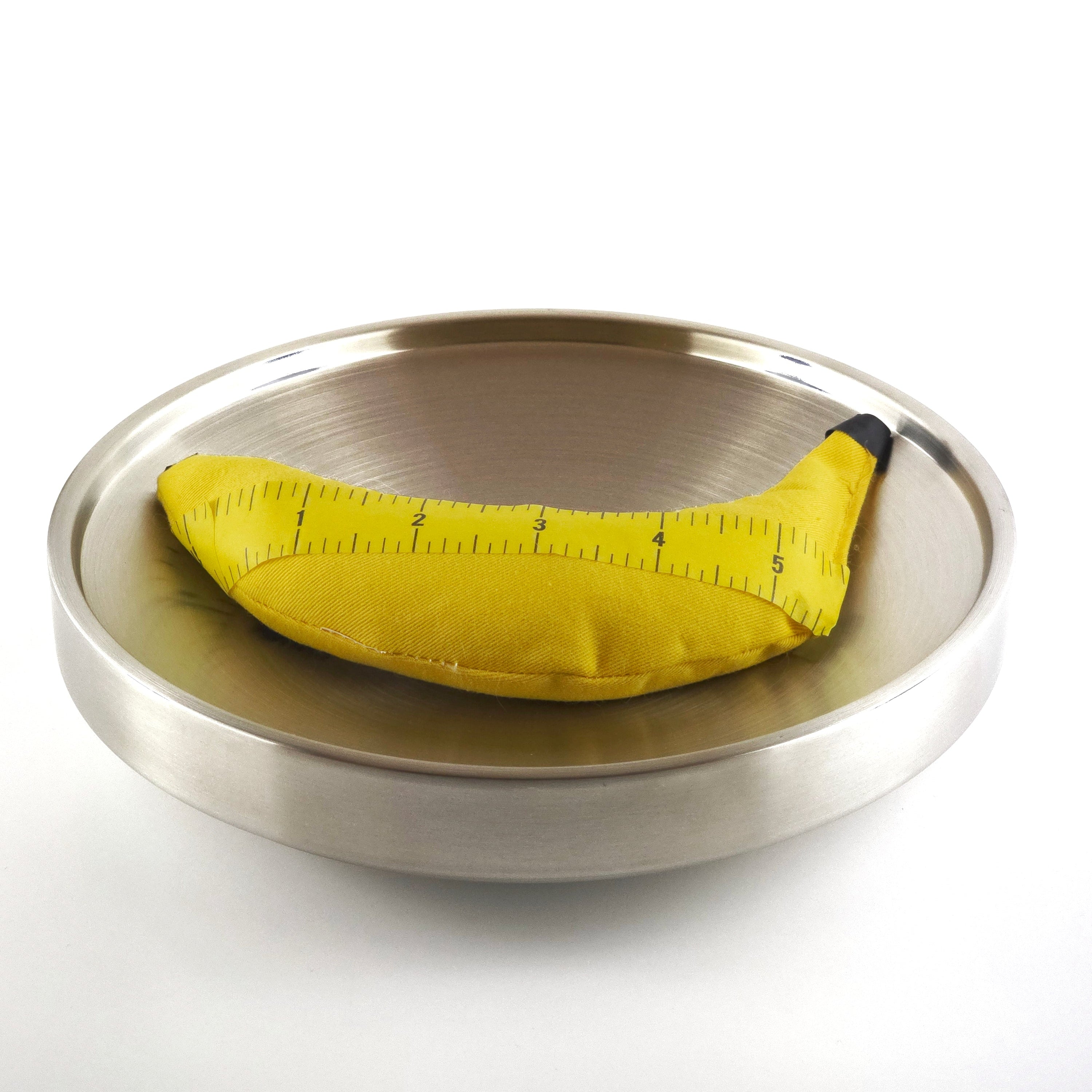 Yellow measuring tape on steel plater on a white background