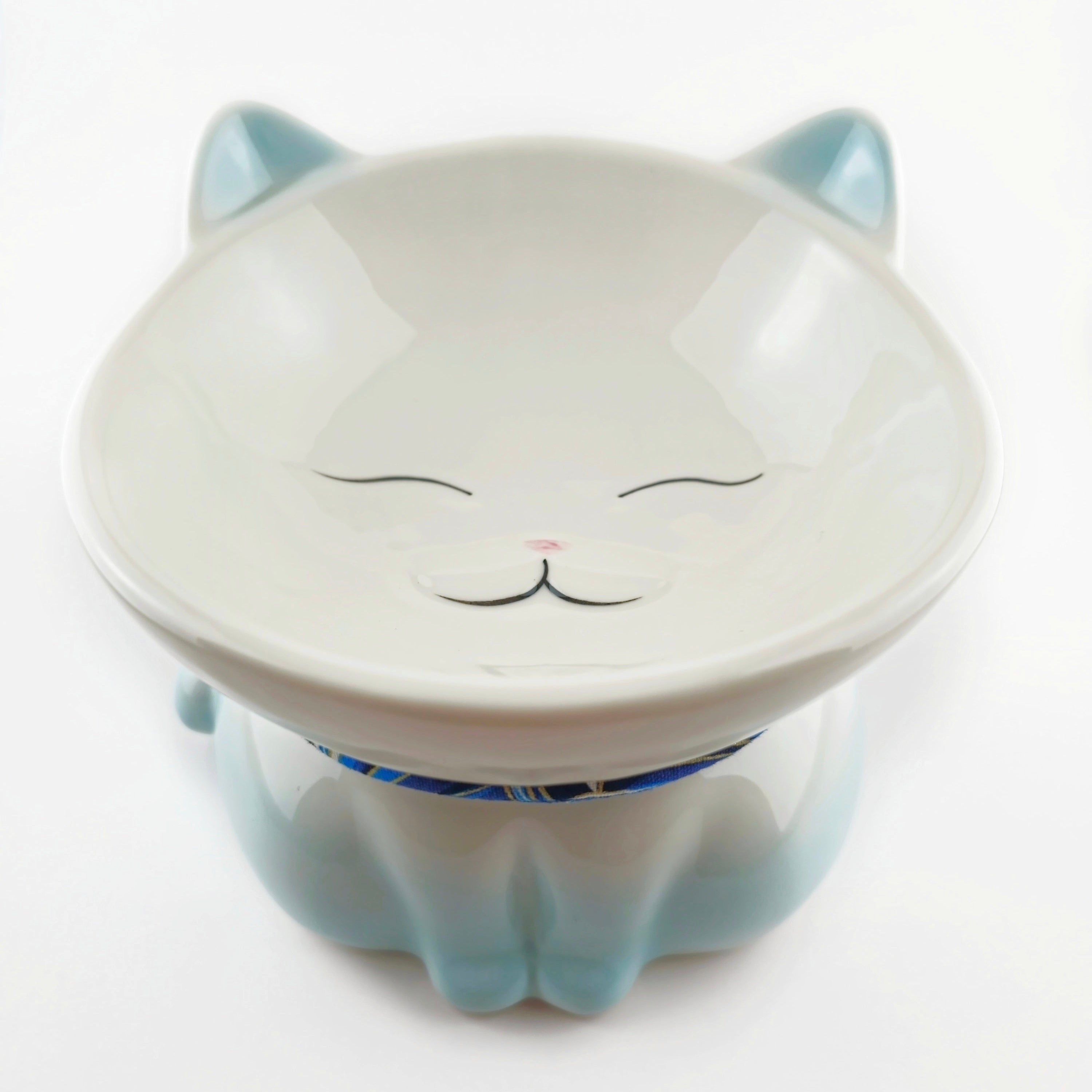 Cat-shaped ceramic product on a white background