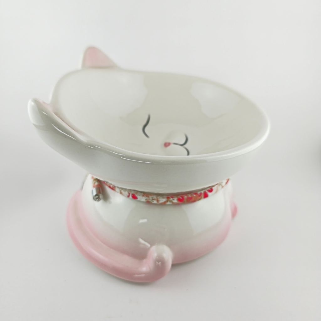 Ceramic cat-shaped bowl with a floral pattern on a white background