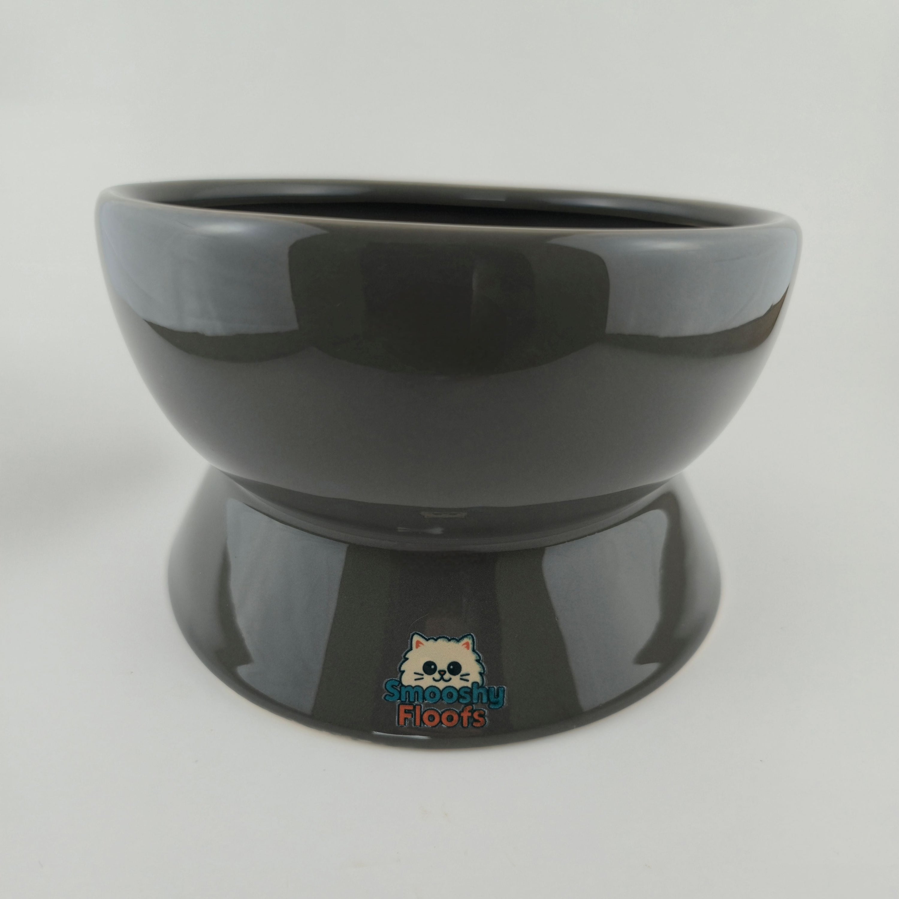 Black elevated pet feeder on a white background