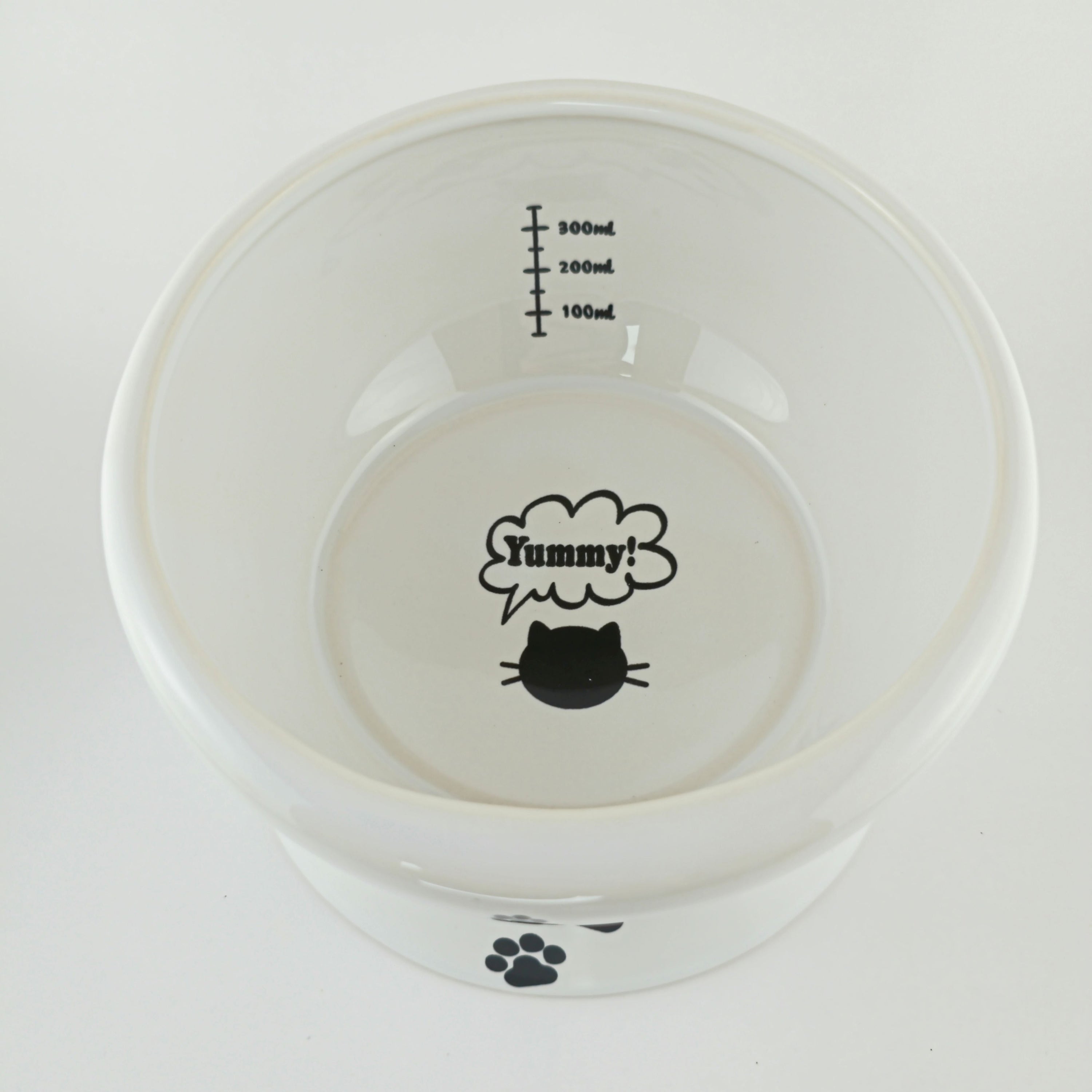 White pet bowl with black text and graphics on a white background