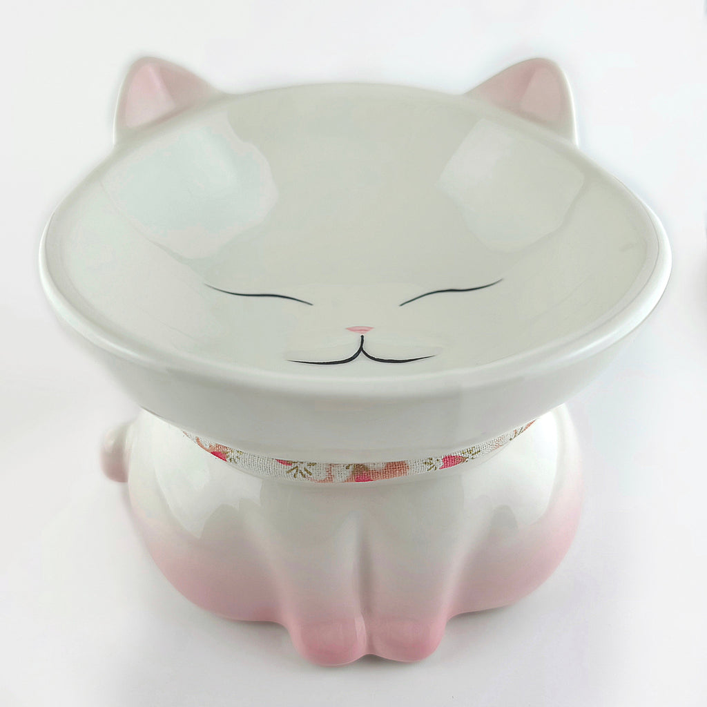 Ceramic cat-shaped bowl with a floral collar on a white background