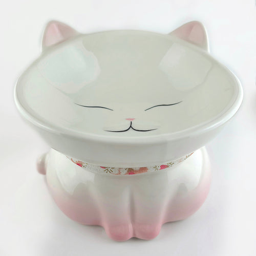 Ceramic cat-shaped bowl with a floral collar on a white background